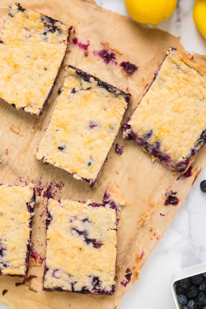 sliced blueberry pie bars on parchment