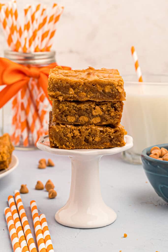 stacked butterscotch blondies on cake stand