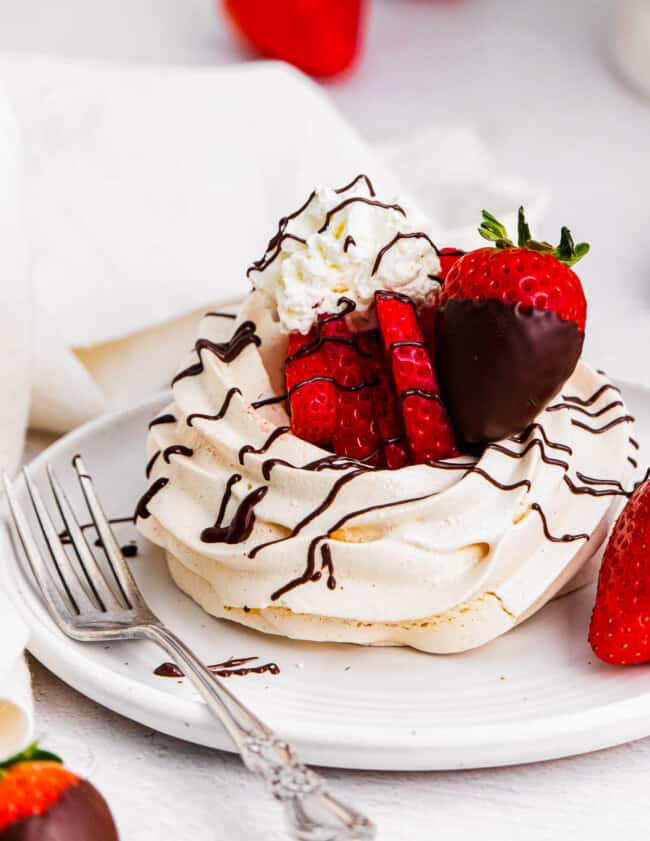 chocolate covered strawberry pavlova on plate
