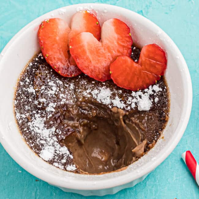 chocolate creme brulee with strawberries and powdered sugar