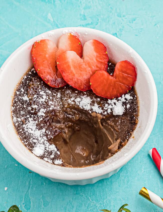 chocolate creme brulee with strawberries and powdered sugar