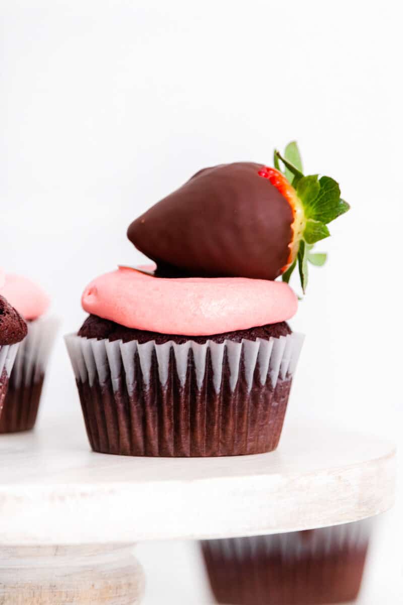 chocolate covered strawberry cupcakes on cake stand