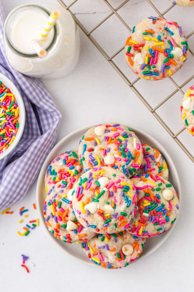 stacked funfetti cookies on white plate