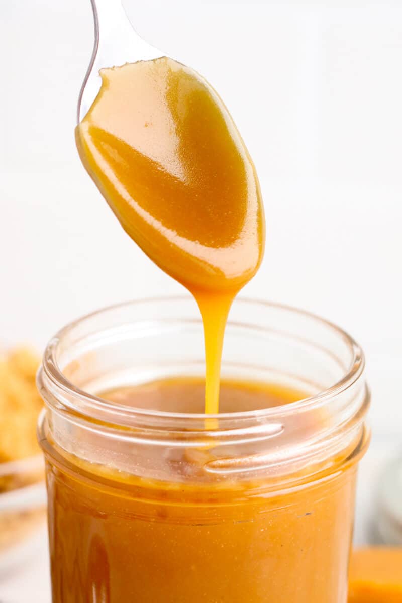 spoon lifting up caramel sauce