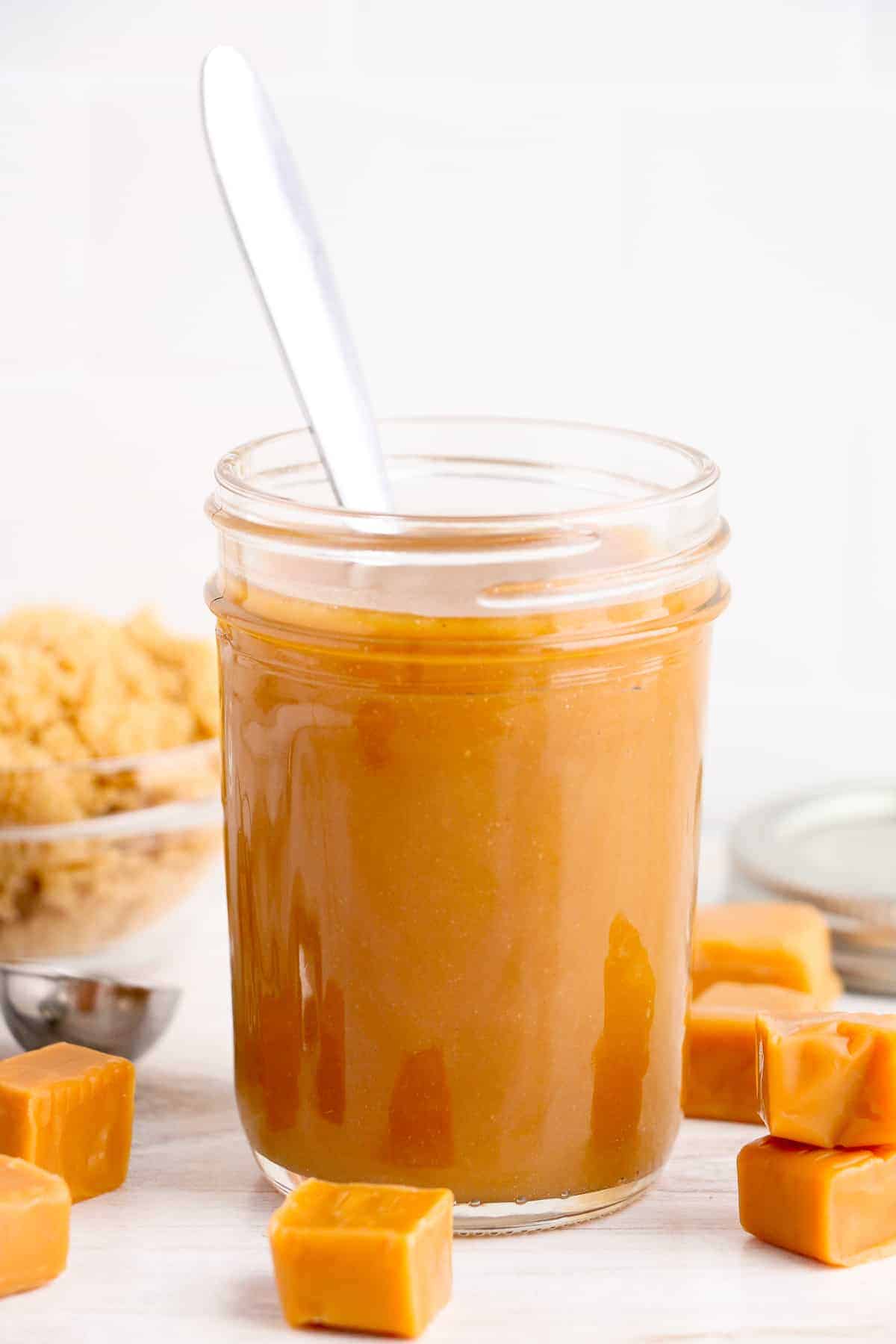 spoon in jar of homemade caramel