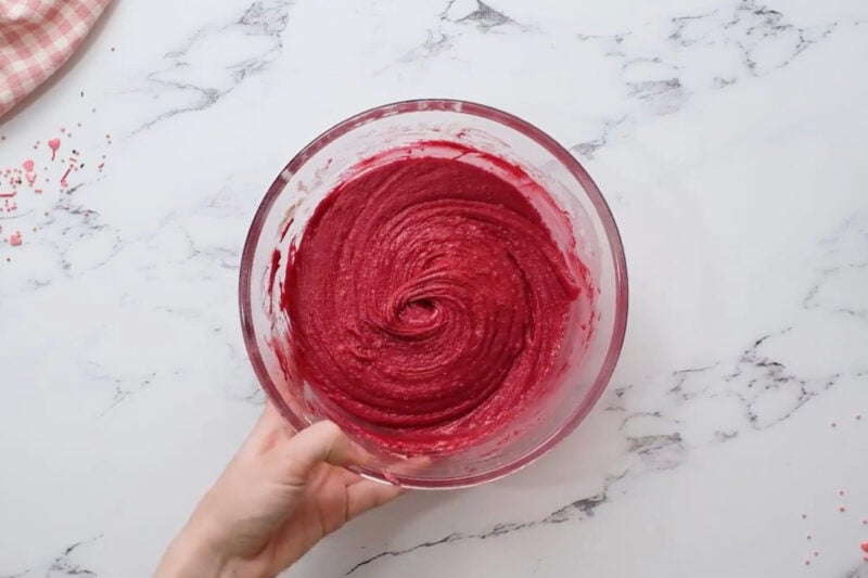 red velvet fudge batter in a glass bowl.