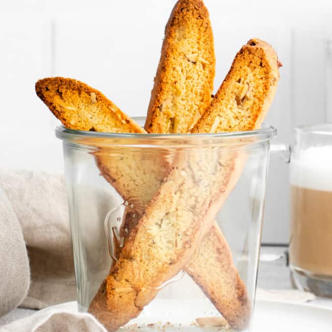 3 almond biscotti in glass cup