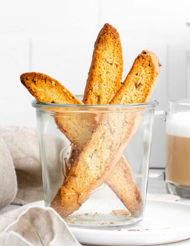 3 almond biscotti in glass cup