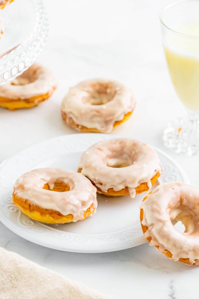 vanilla glazed baked donuts on white plate