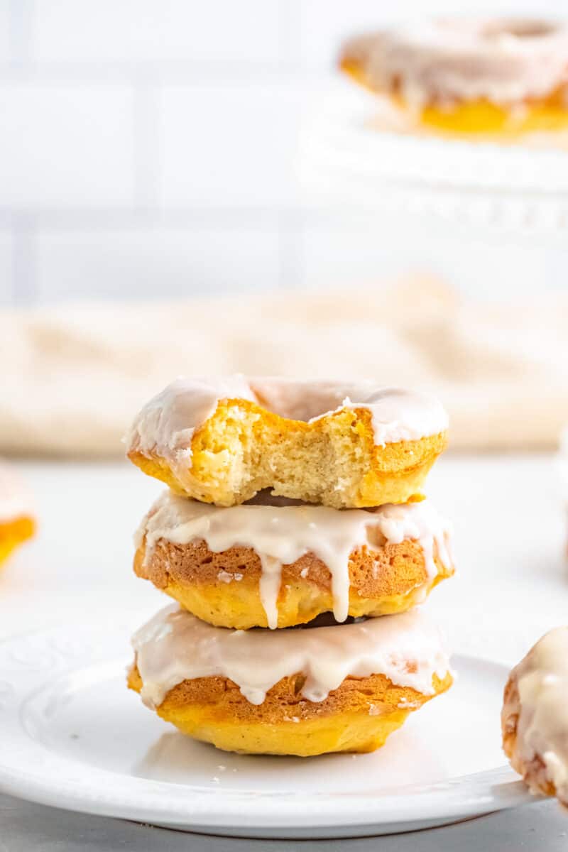bite out of vanilla glazed baked donuts