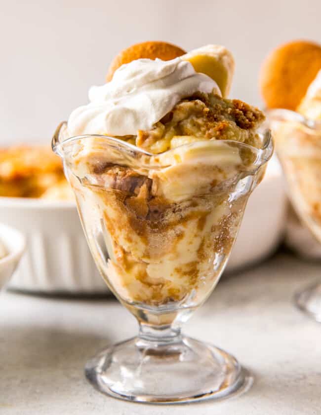 up close banana pudding in parfait dish with whipped cream