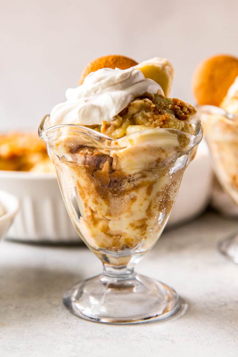 up close banana pudding in parfait dish with whipped cream