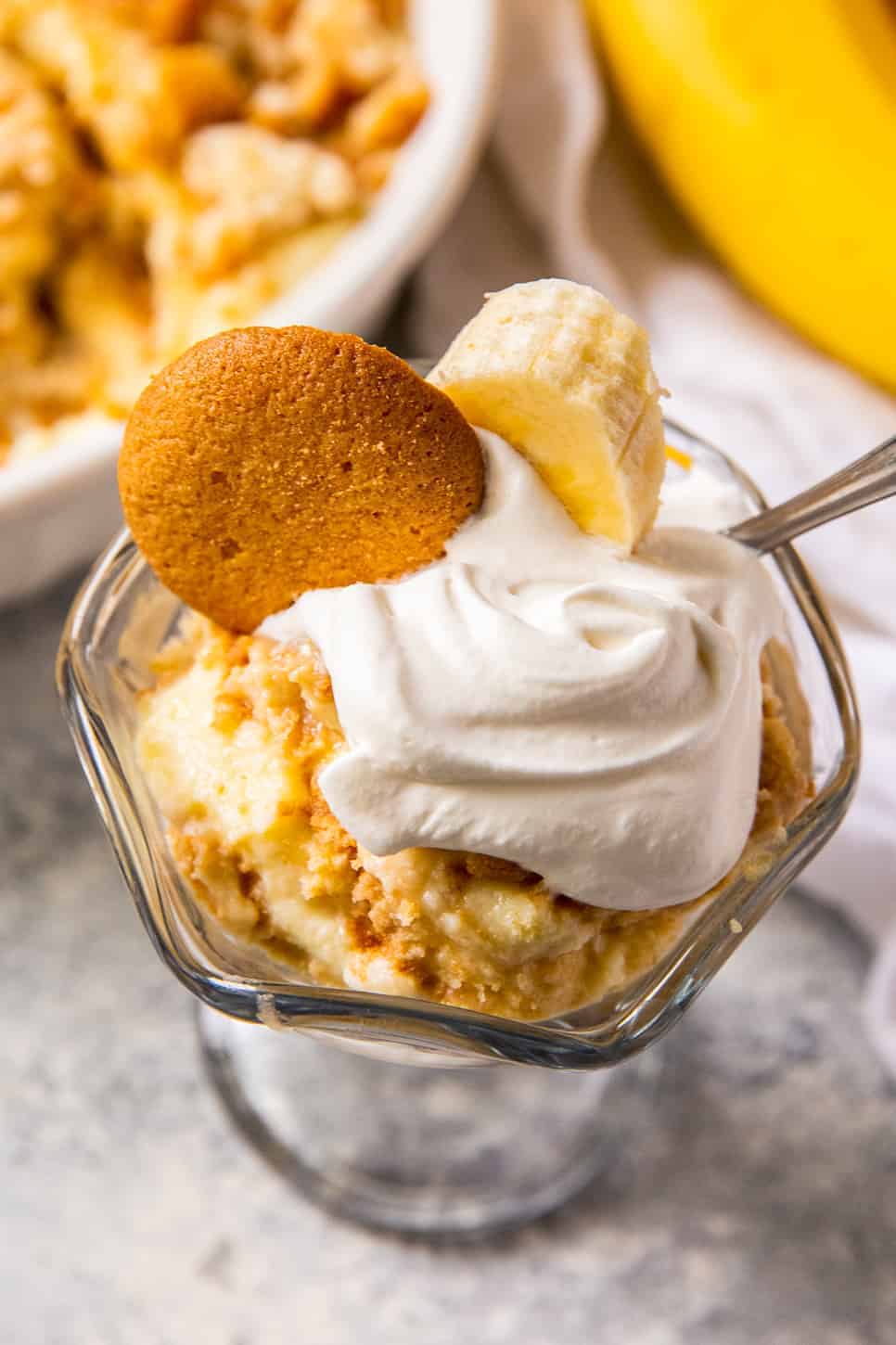 overhead banana pudding in parfait dish with whipped cream