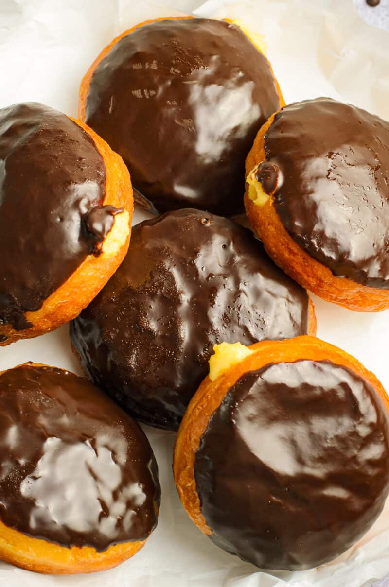 up close image of chocolate cream donuts