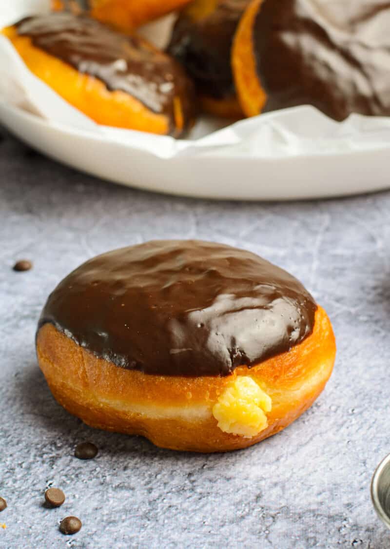 chocolate cream donuts on table