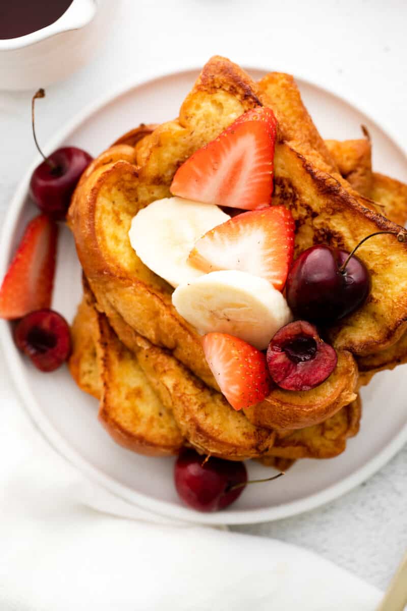 overhead brioche french toast topped with fresh fruit