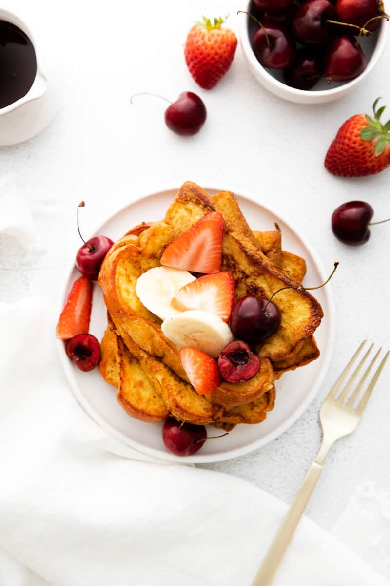 overhead brioche french toast topped with fresh fruit