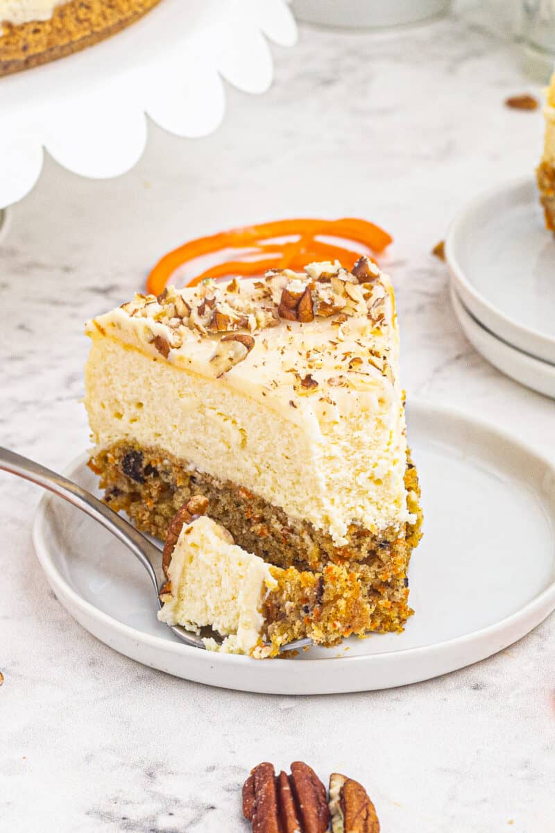 slice of carrot cake cheesecake with bite out