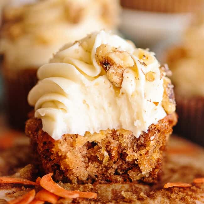 bite out of carrot cake cupcake