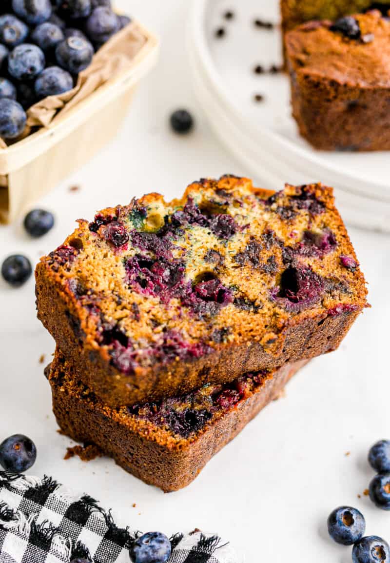 two stacked slices of chocolate chip blueberry banana bread