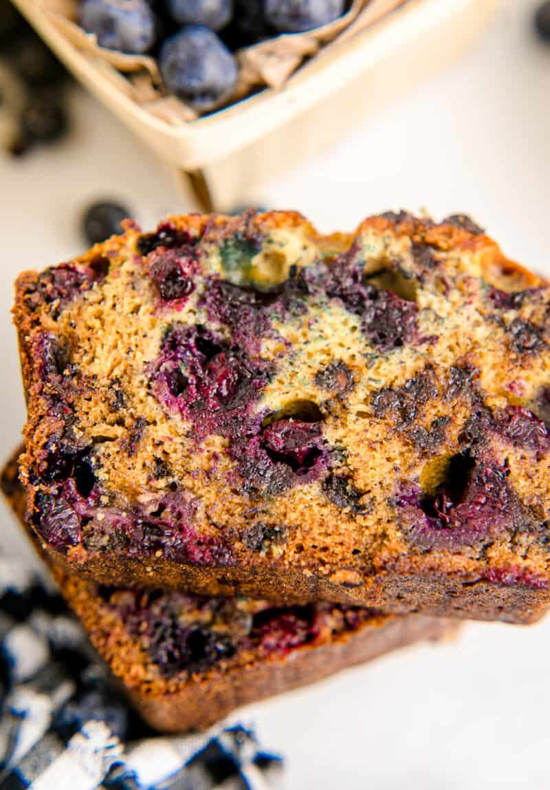 up close two stacked slices of chocolate chip blueberry banana bread