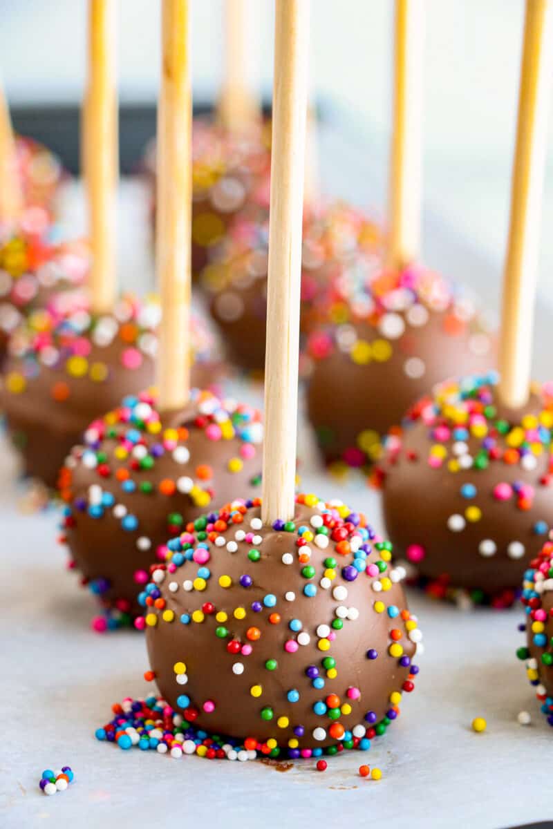 chocolate covered strawberry cake pops with sprinkles
