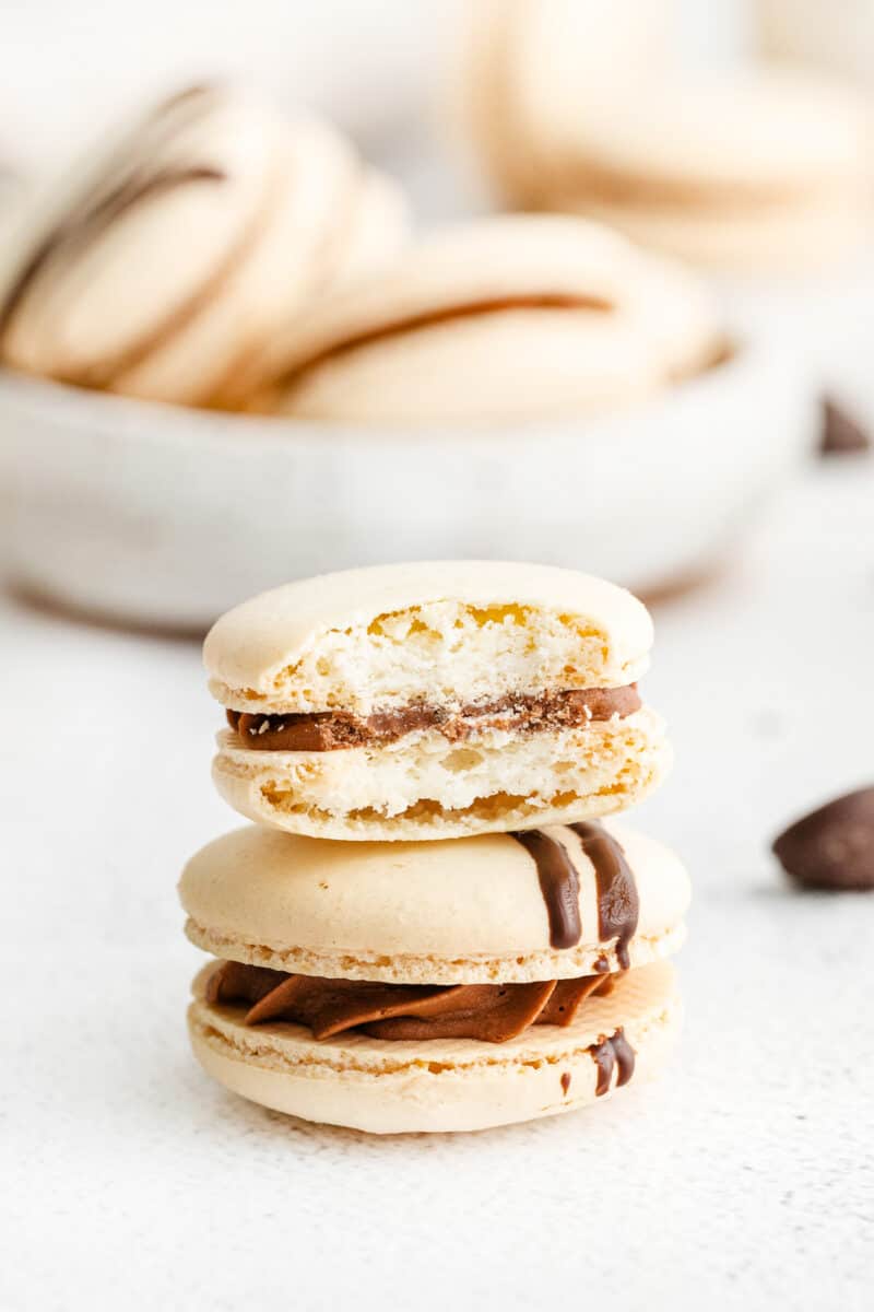 two macarons with one with bite out