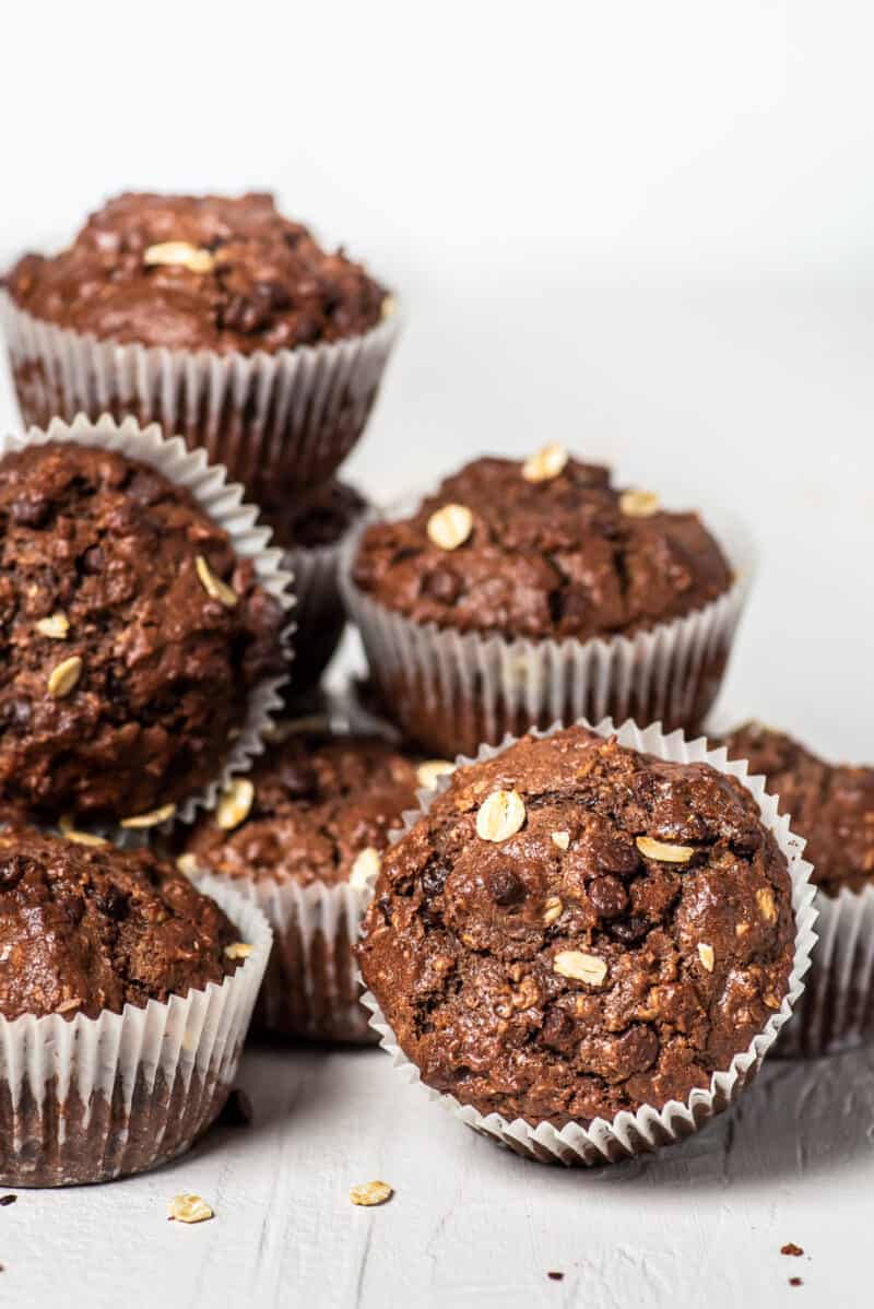 chocolate oatmeal muffins stacked on white table