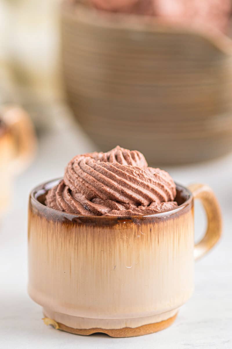 chocolate whipped cream frosting in mugs