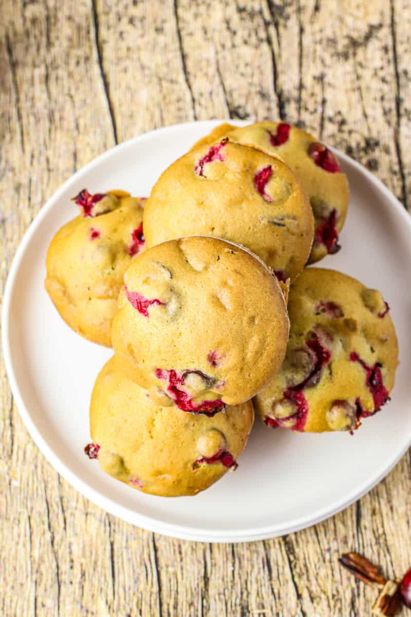 cranberry pecan muffins on white plate