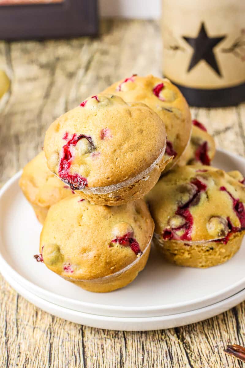 healthy cranberry pecan muffins on white plate