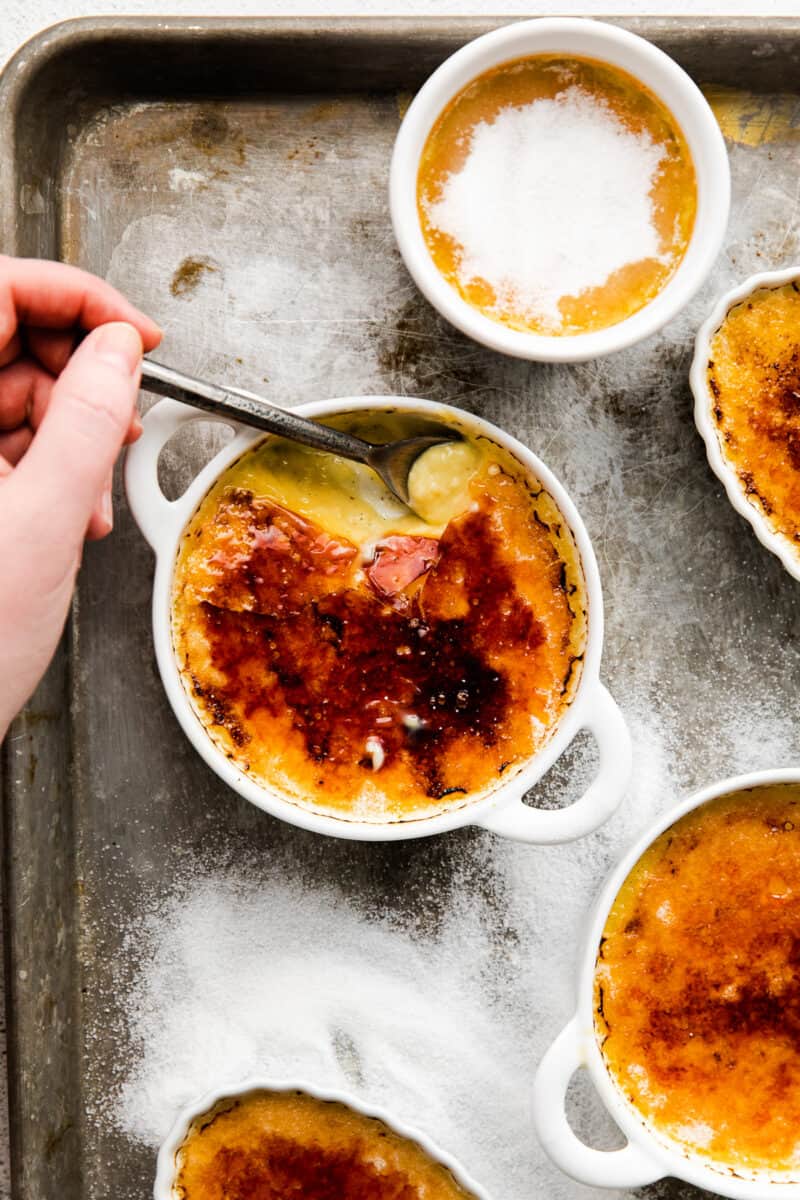 putting spoon into creme brulee