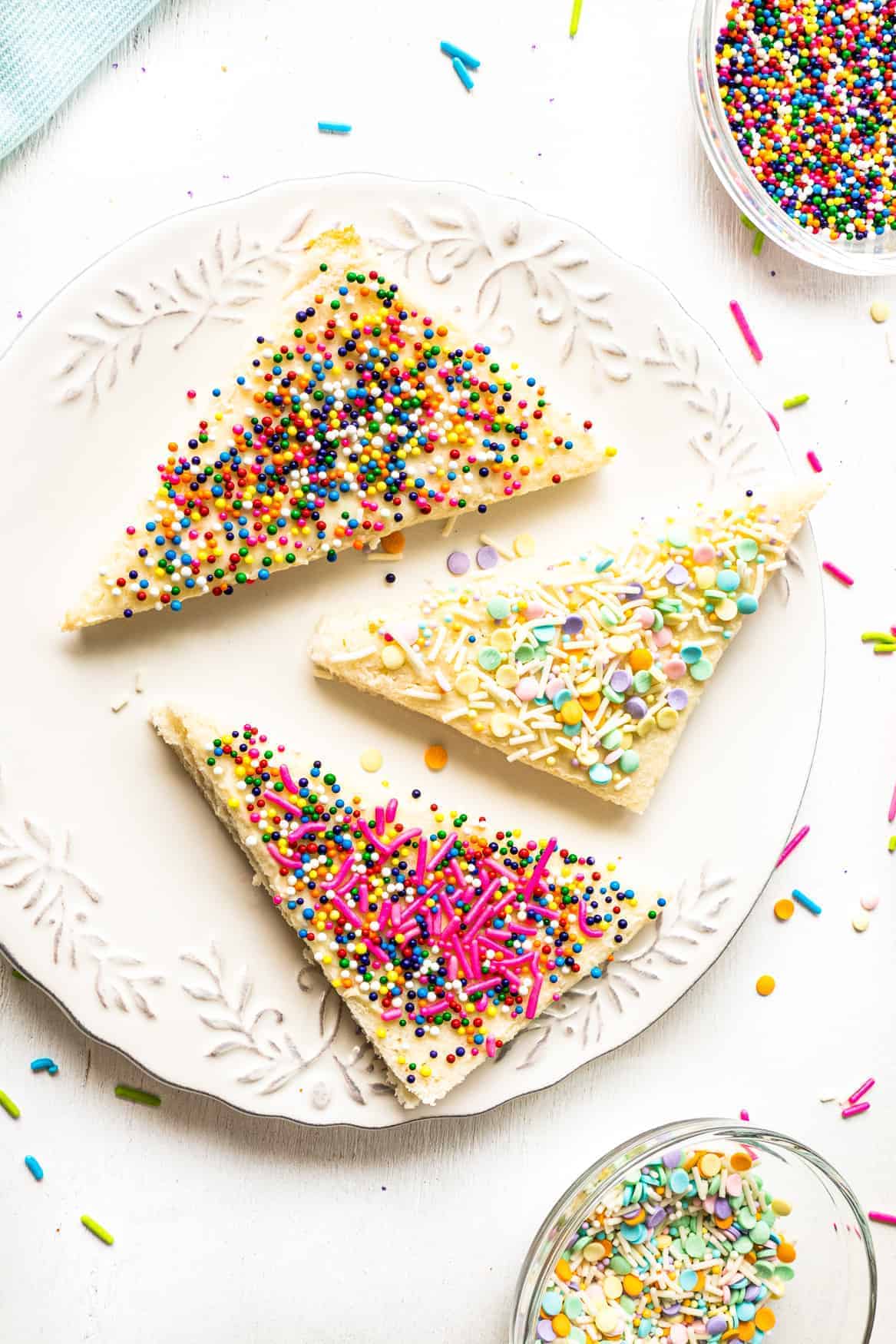 sprinkled fairy bread slices on white plate