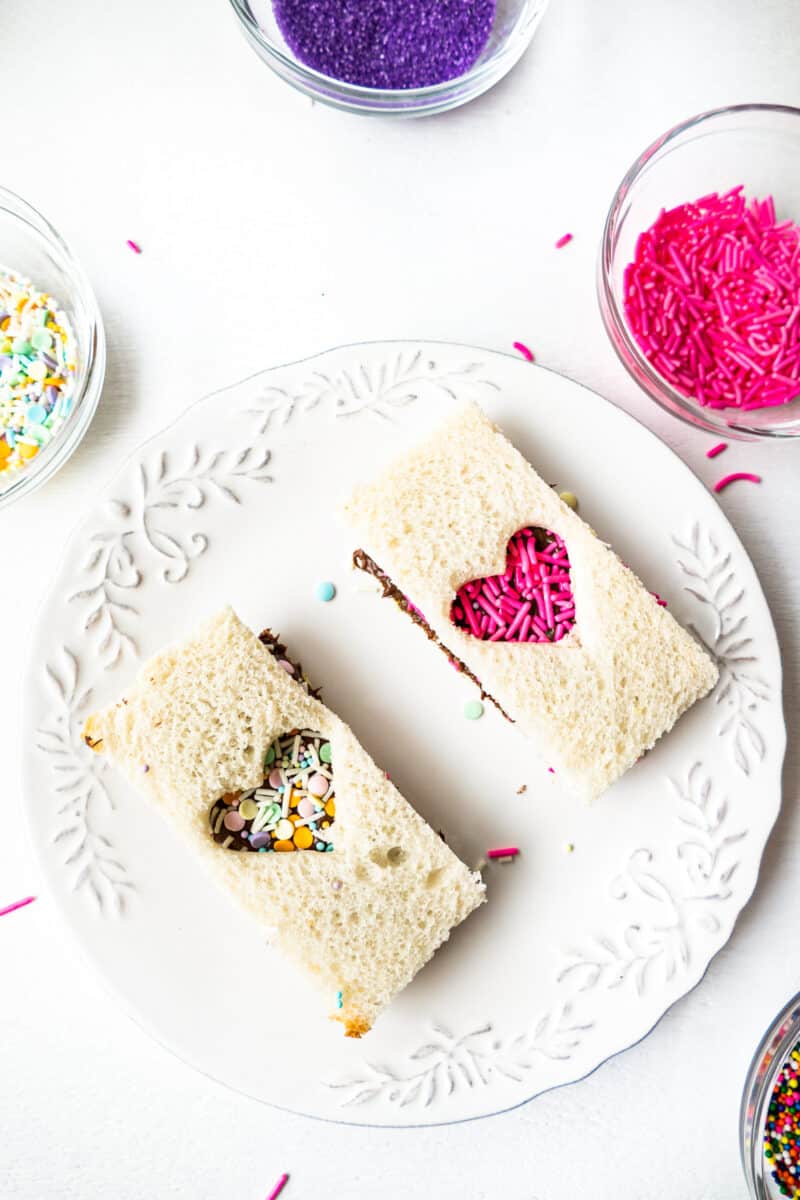 fairy bread with nutella cut outs on white plate