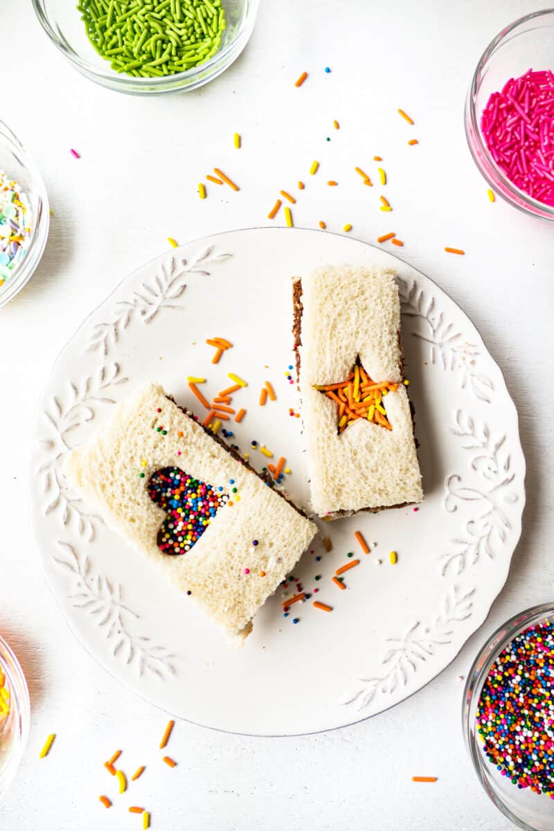 fairy bread with nutella cut outs on white plate