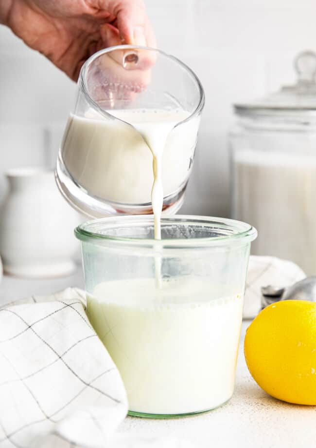 pouring homemade buttermilk into jar