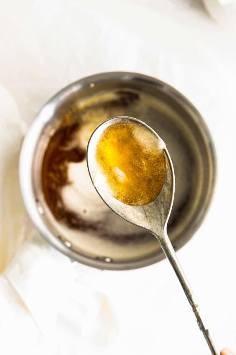 overhead brown butter on metal spoon