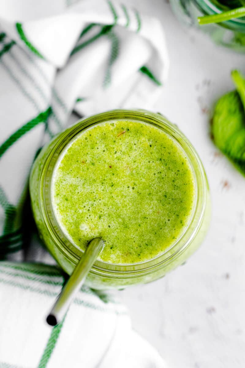 overhead island green smoothie with metal straw