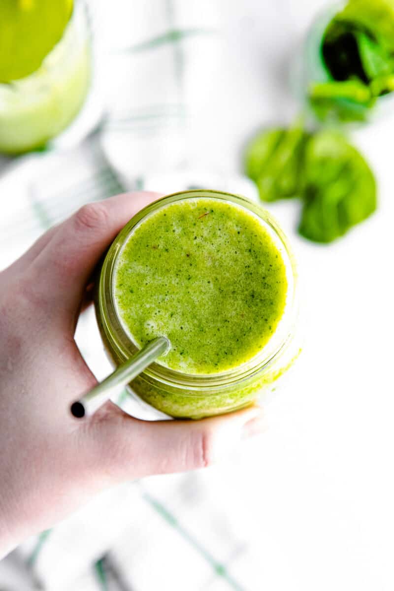 overhead island green smoothie with metal straw