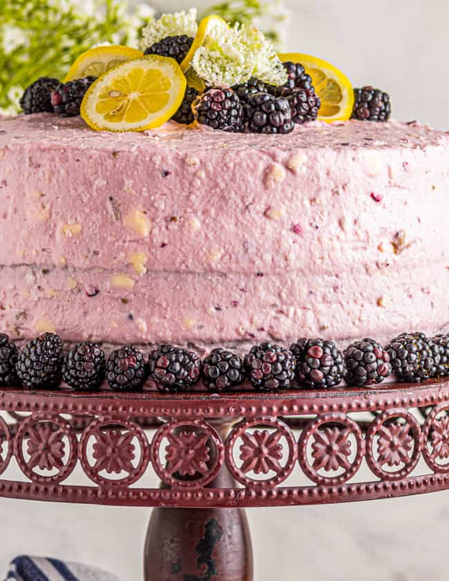 lemon blackberry cake on cake stand