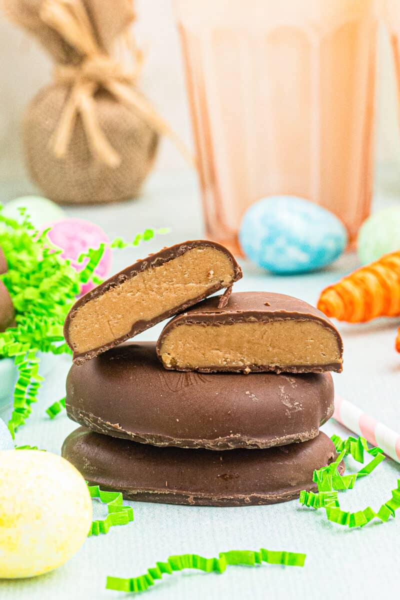 stacked reese's peanut butter eggs cut in half showing inside