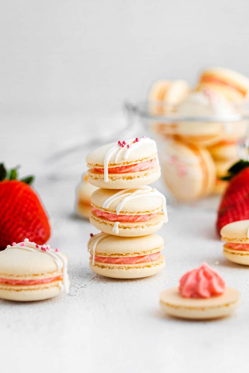 stacked strawberry macarons on white table