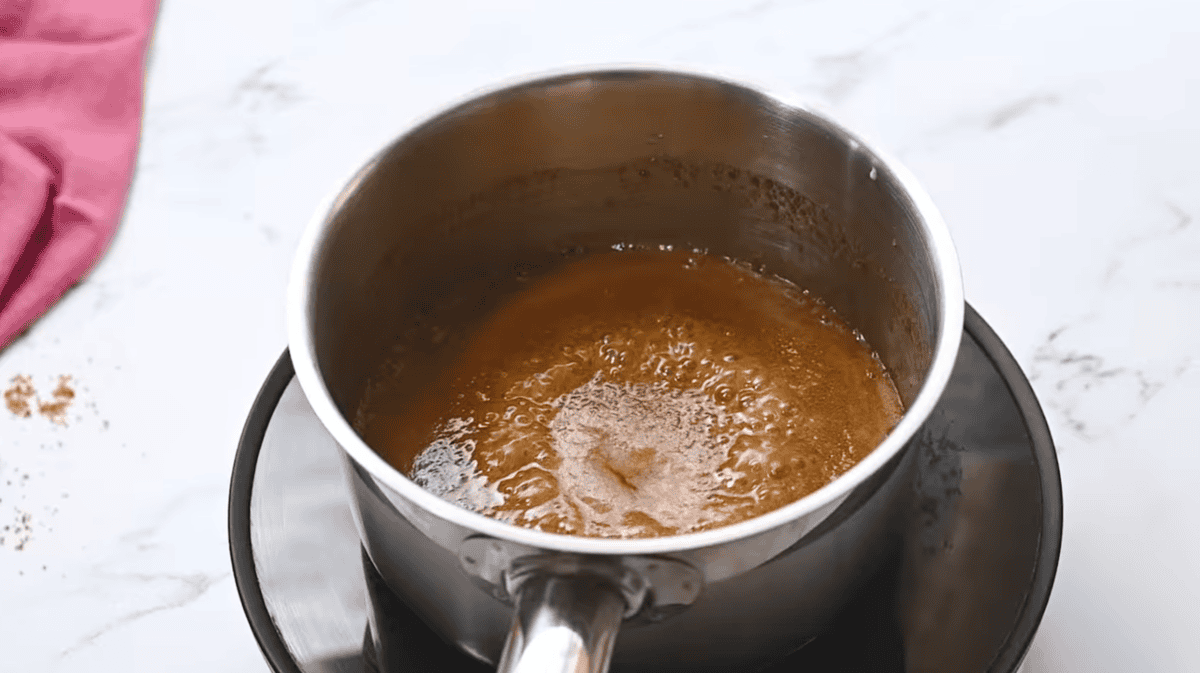 simmering caramel in a saucepan.