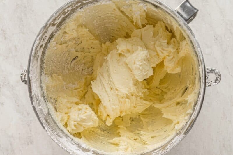 beaten buttercream frosting in a stand mixer bowl.