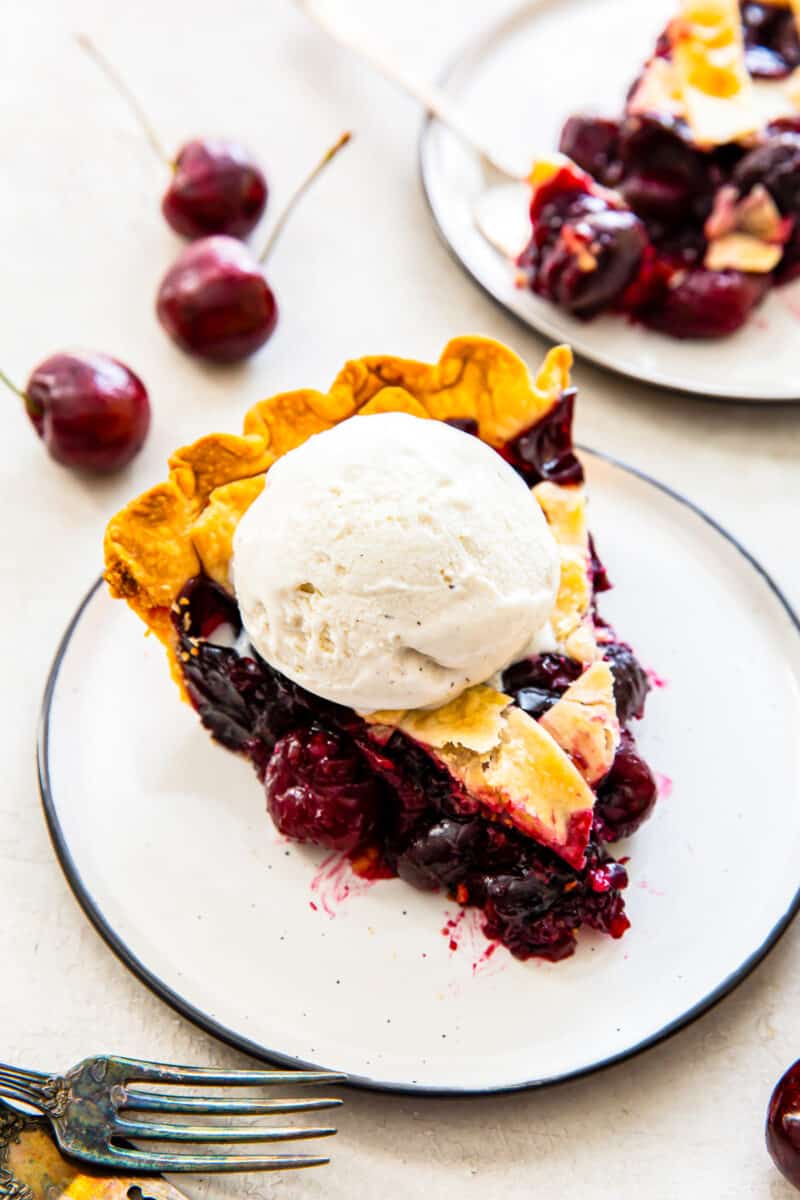 slice of cherry pie with vanilla ice cream
