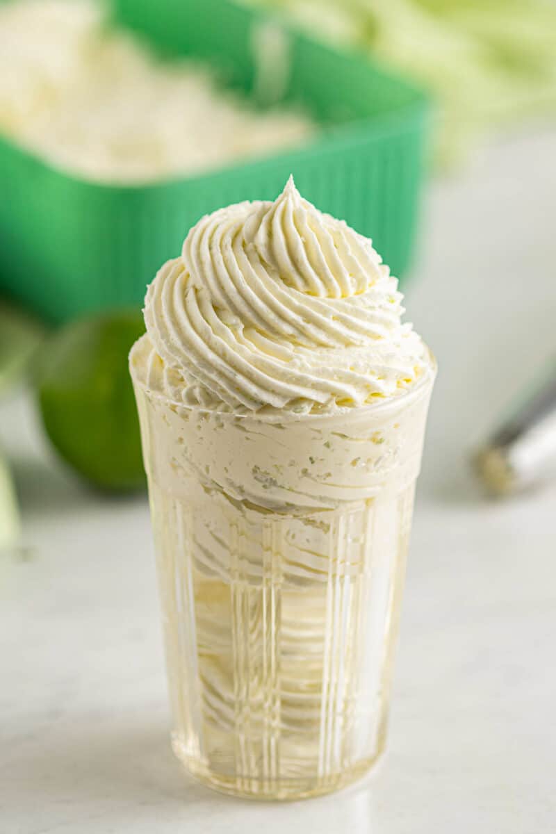 lime buttercream piped into glass cup