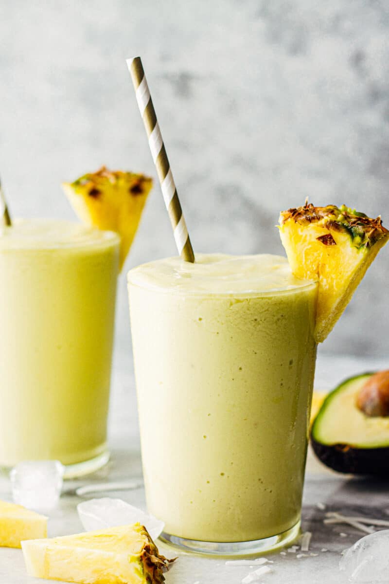 pineapple avocado smoothie recipe garnished with fresh pineapple