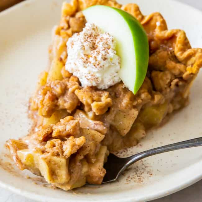 slice of dutch apple pie with whipped cream