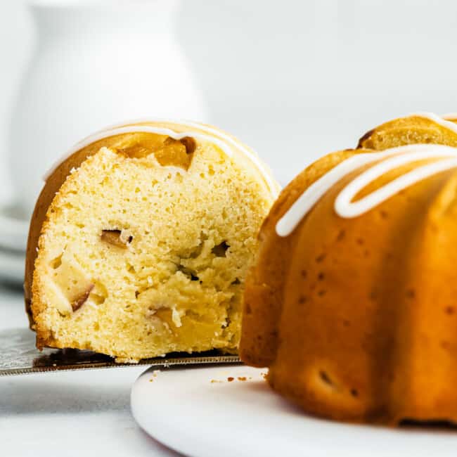 side image of slice being taken out of peach bundt cake
