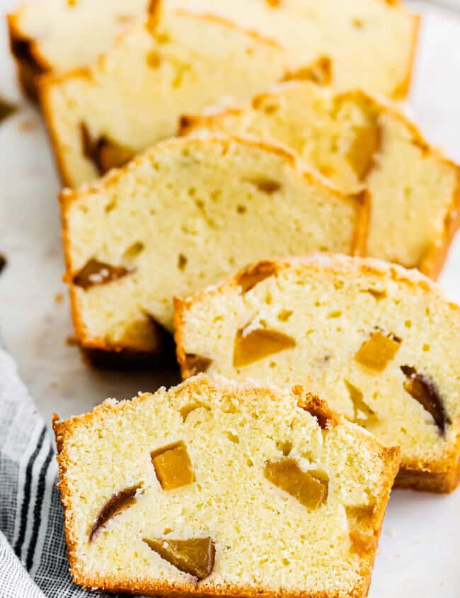 up close sliced of peach pound cake on platter